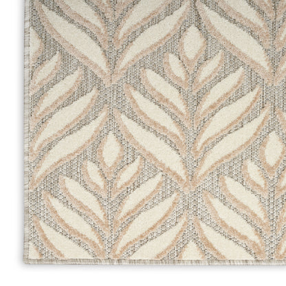 Neutral beige & cream woven area rug with tan leaf pattern & textured jacquard weave