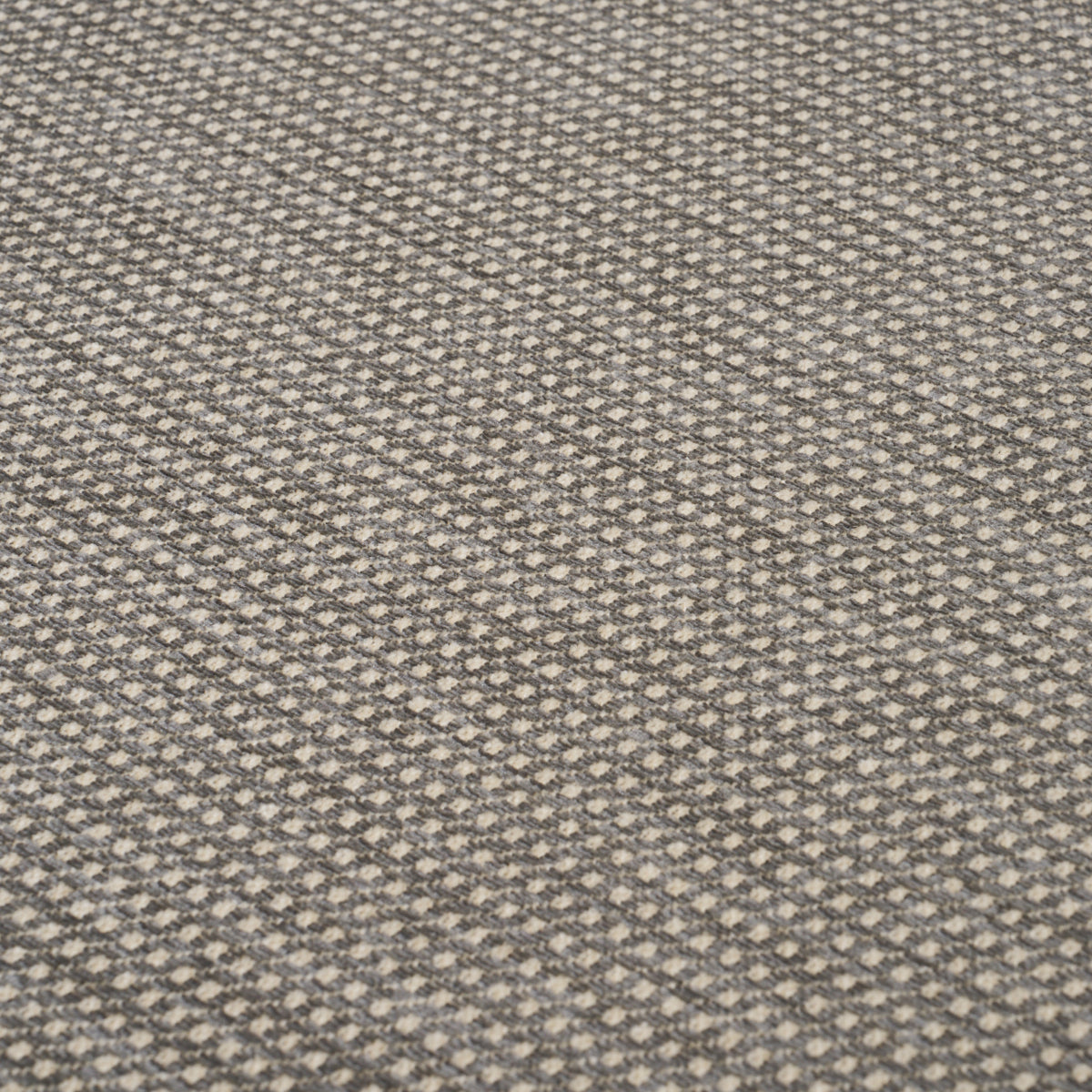 Gray and beige woven carpet with a tiny diamond geometric pattern and soft textured loops.