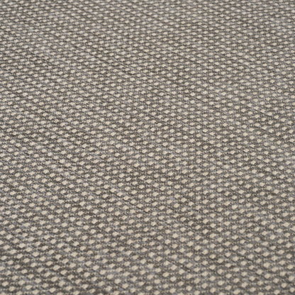 Gray and beige woven carpet with a tiny diamond geometric pattern and soft textured loops.