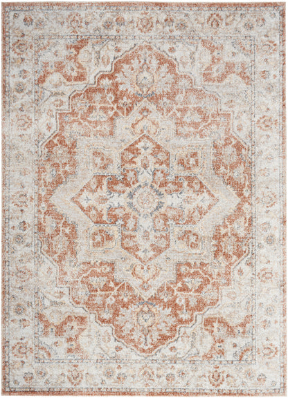 Rectangular distressed oriental rug with a peach and ivory central medallion, pale blue accents and an ornate border.