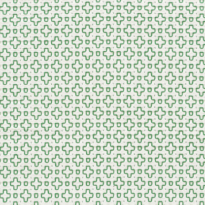 Repeating lime-green cross pattern on white fabric; geometric textile print for clothing or decor.