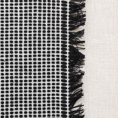 Black-and-white sheer window panels with a subtle grid pattern.