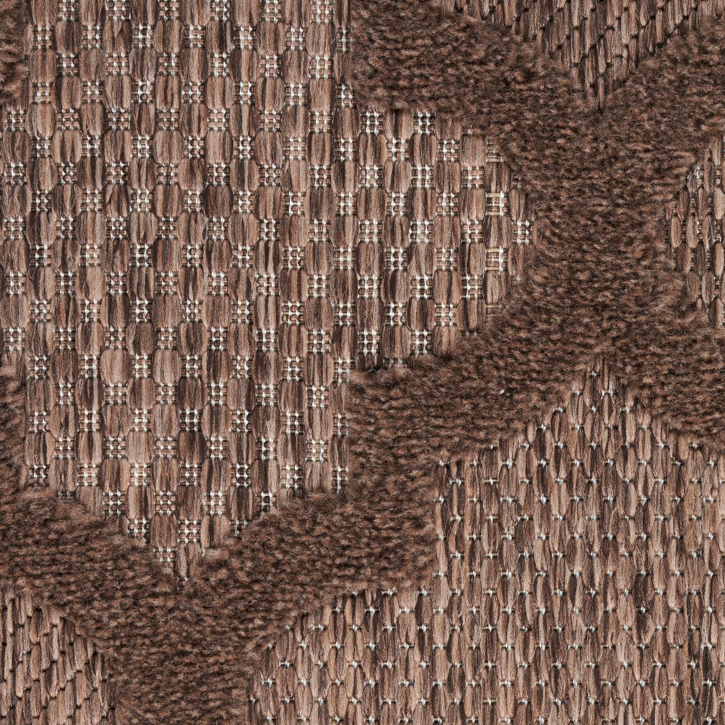 Brown jacquard woven fabric with tan and chocolate chevron pattern; textured upholstery textile for furniture or accessories.