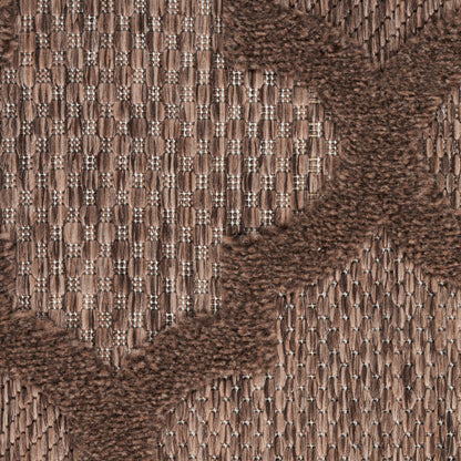 Brown jacquard woven fabric with tan and chocolate chevron pattern; textured upholstery textile for furniture or accessories.