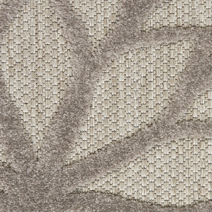Beige textured rug with raised geometric pattern and soft looped pile.