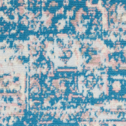Blue and pink distressed oriental rug pattern, woven textile texture, ideal decorative throw or area rug.