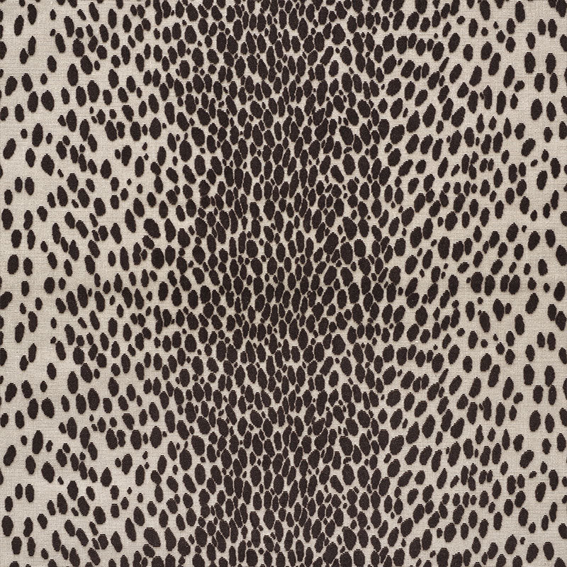 Beige cheetah-print velvet with dense dark brown spots, close-up of the cut velvet texture.