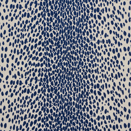 Beige velvet close-up featuring a navy blue irregular dot/teardrop pattern with a denser center.