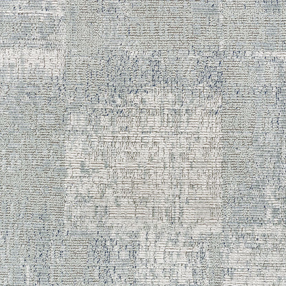 Light gray-blue woven area rug with subtle geometric pattern and textured surface; rectangular, modern style.