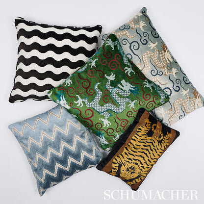 Five rectangular decorative pillows in black-white zigzag, blue chevron, green damask with red swirls, gray swirls, and tiger print.