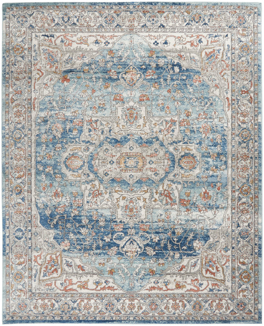 Rectangular oriental area rug in blue and ivory tones with a central medallion and ornate border.