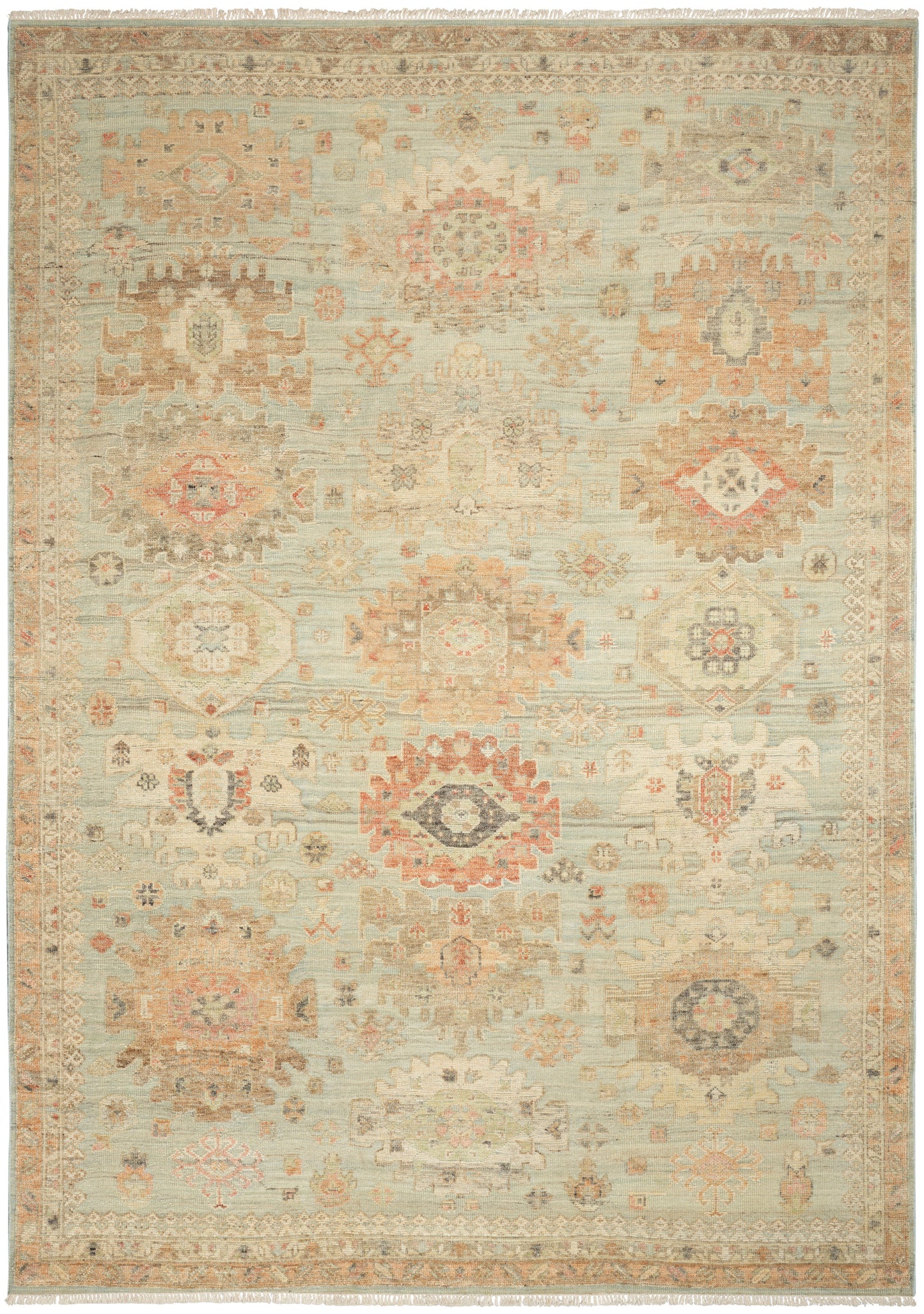Pastel-toned oriental rug with medallion motifs in blues, pinks, ivories; fringed edges, vintage faded look.