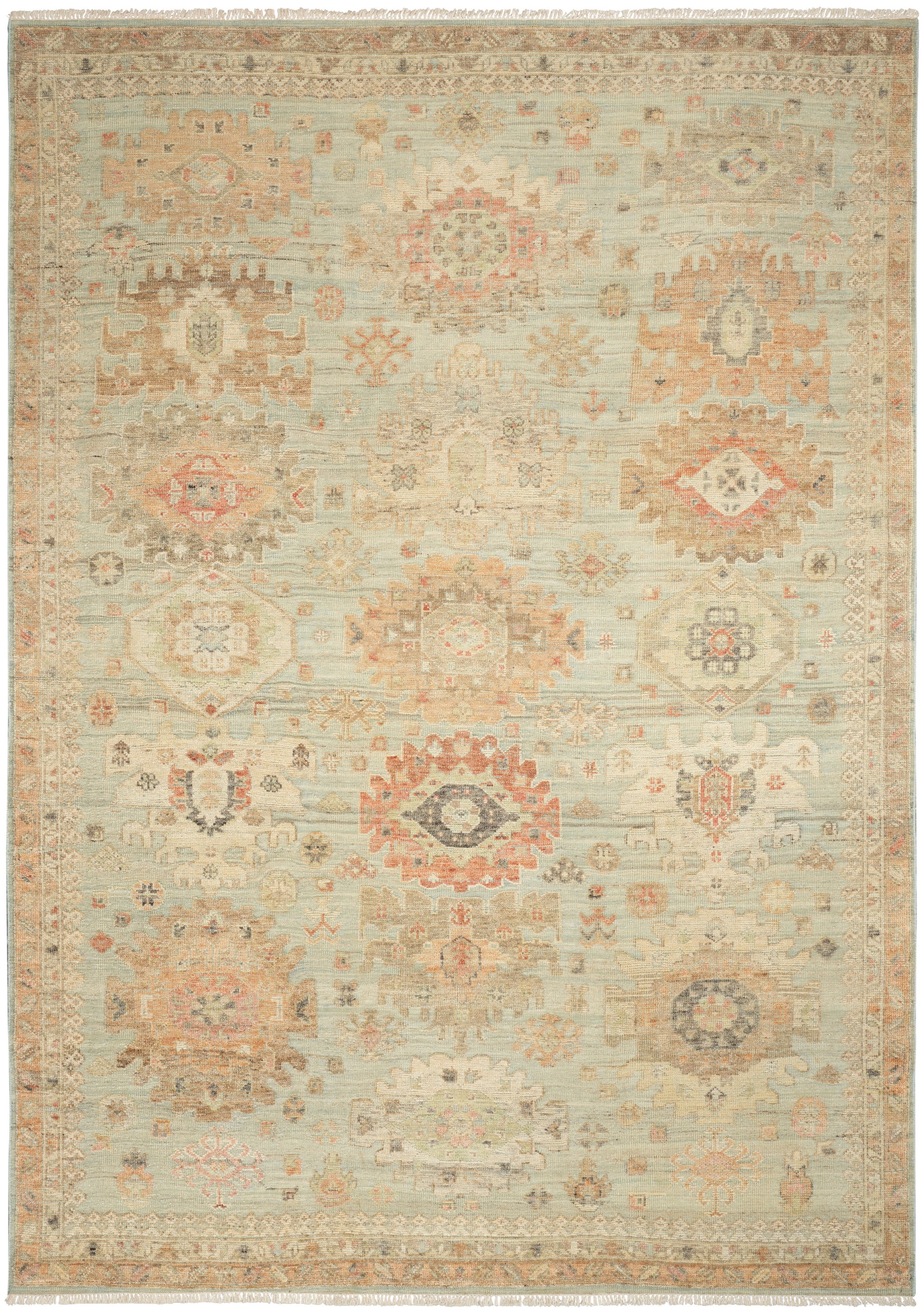 Pastel-toned oriental rug with medallion motifs in blues, pinks, ivories; fringed edges, vintage faded look.