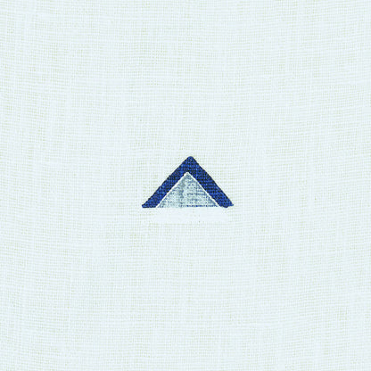 Navy and white overlapping triangle pattern on woven fabric.
