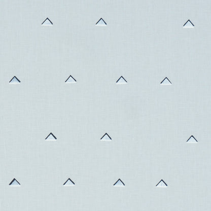 Light sky-blue fabric with overlapping navy and white triangles in a regular grid; linen-like texture.