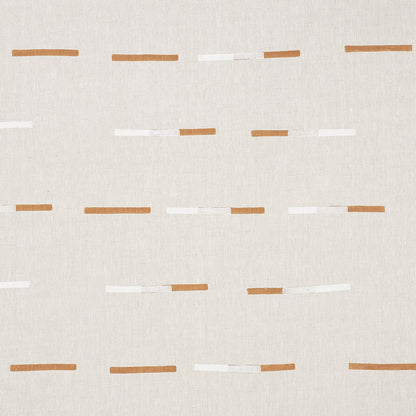 Beige woven fabric with overlapping brown and white dash pattern, decorative upholstery fabric.