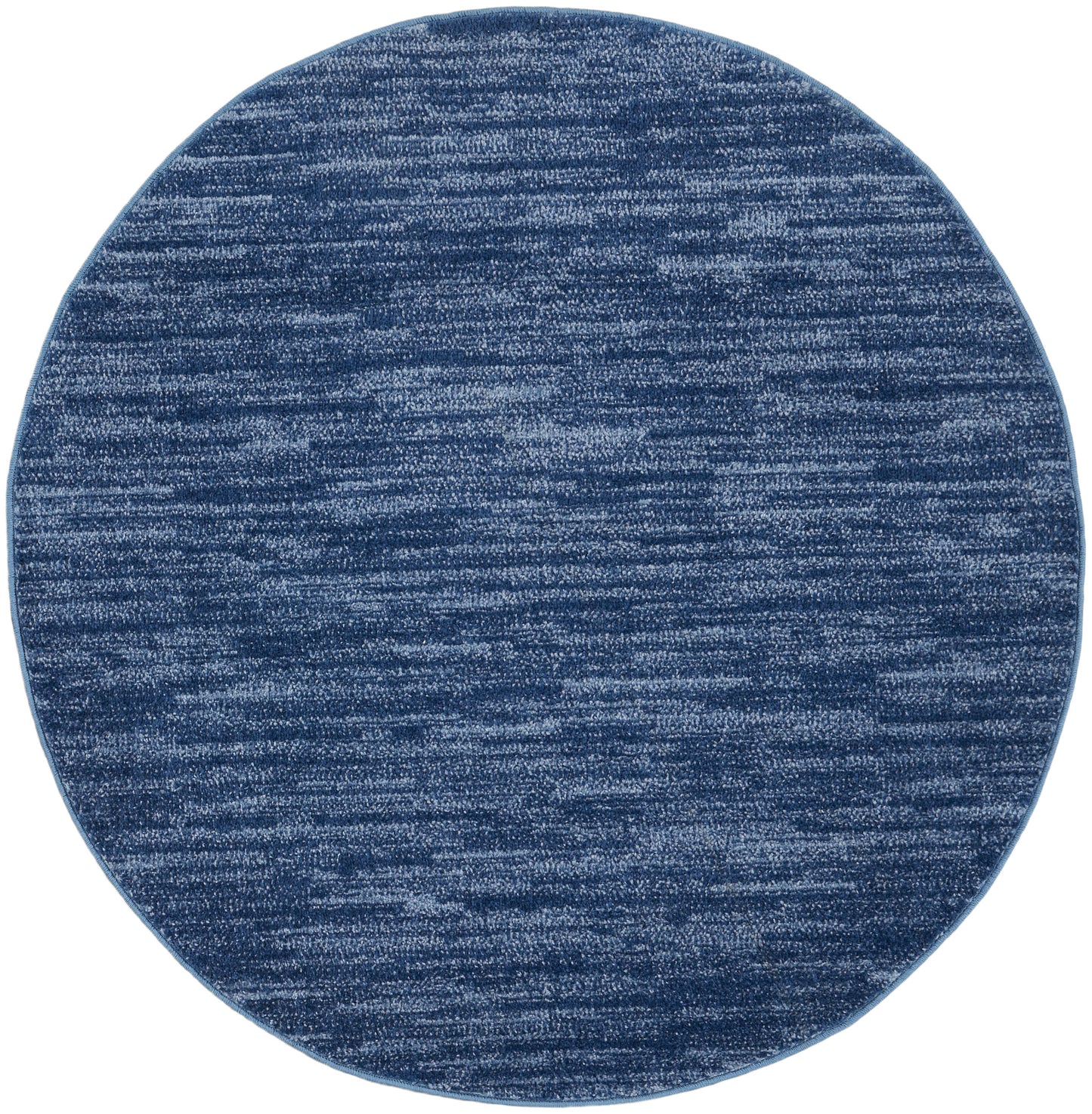 Round blue rug with heathered navy & lighter blue fibers; soft woven texture.
