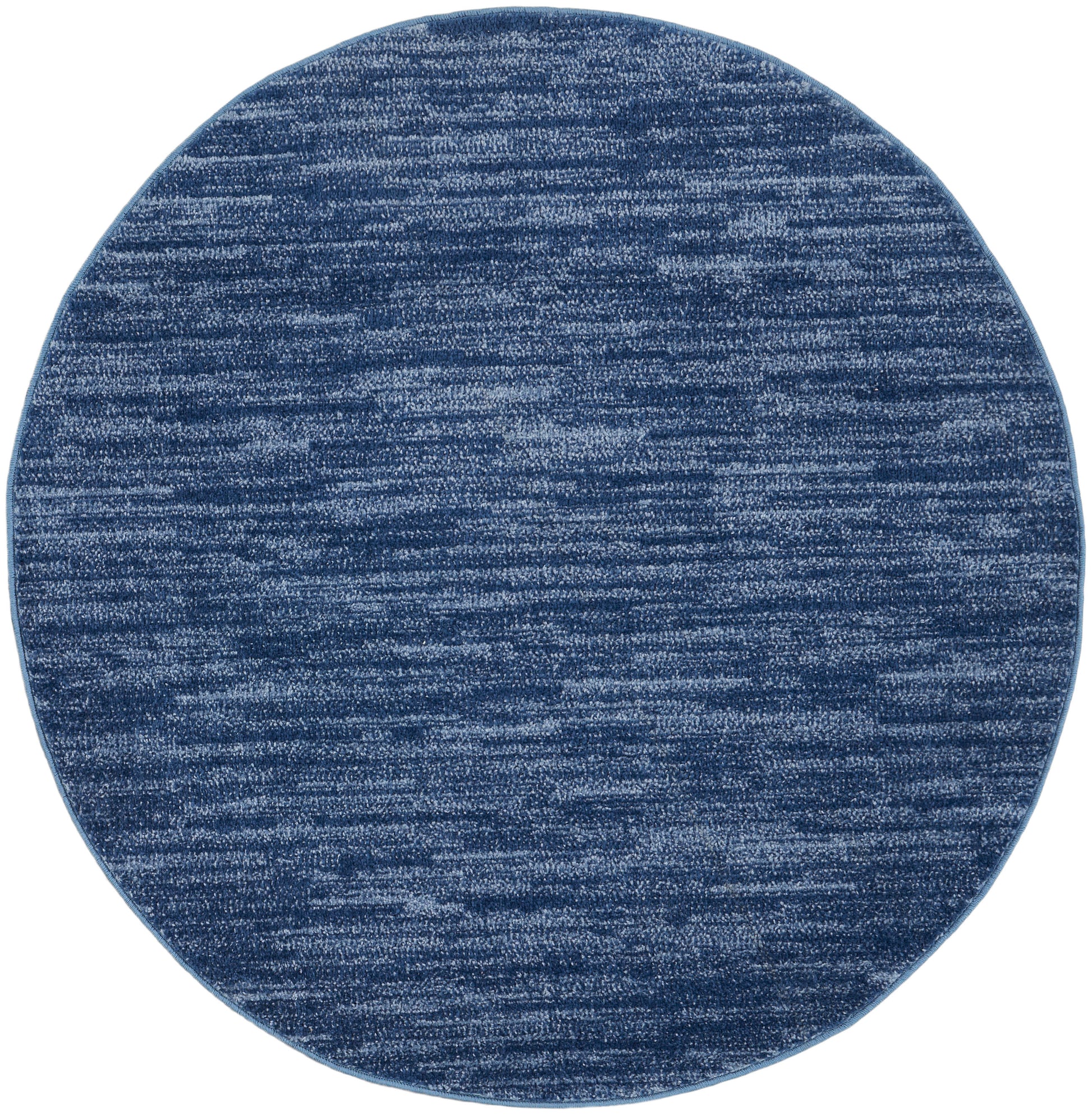 Round blue rug with heathered navy & lighter blue fibers; soft woven texture.
