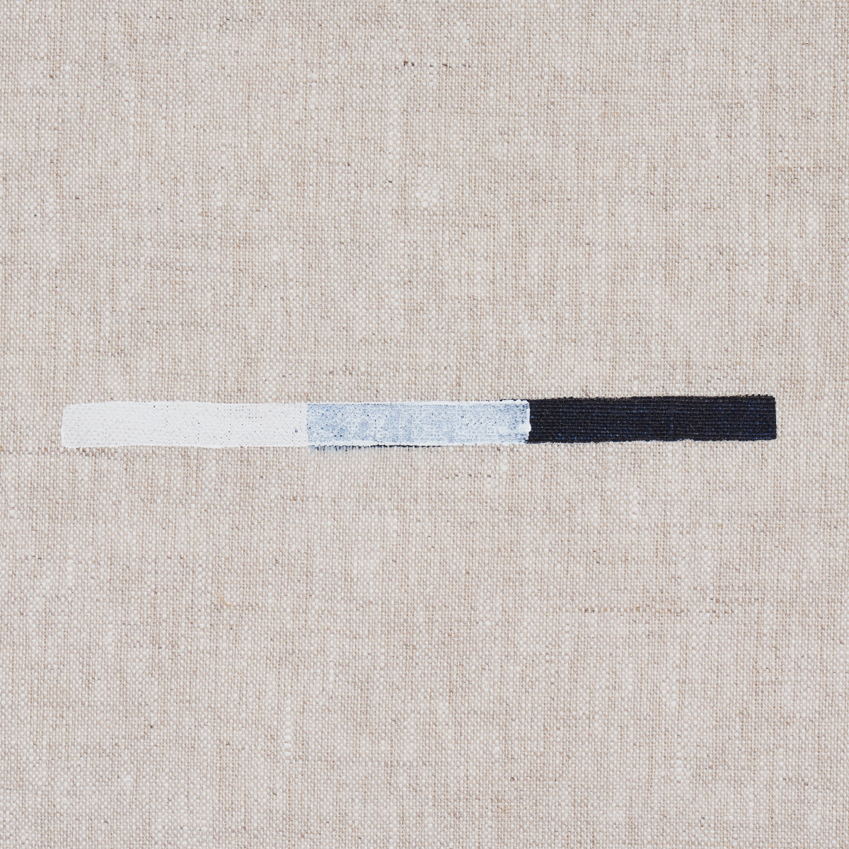 Overlapping dash print in white, light blue-gray, and navy on beige linen background.