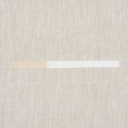 Beige print featuring an overlapping dashed-line pattern.