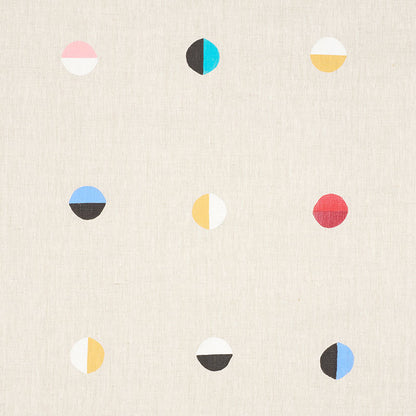 Nine small two-tone circles in a 3x3 grid on textured beige fabric, each circle split into bold color halves.