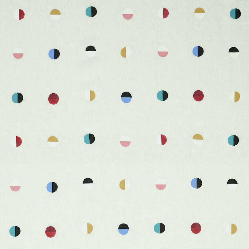 Ivory fabric with a regular grid of small multi-colored moons in red, teal, pink, gold, blue and black.