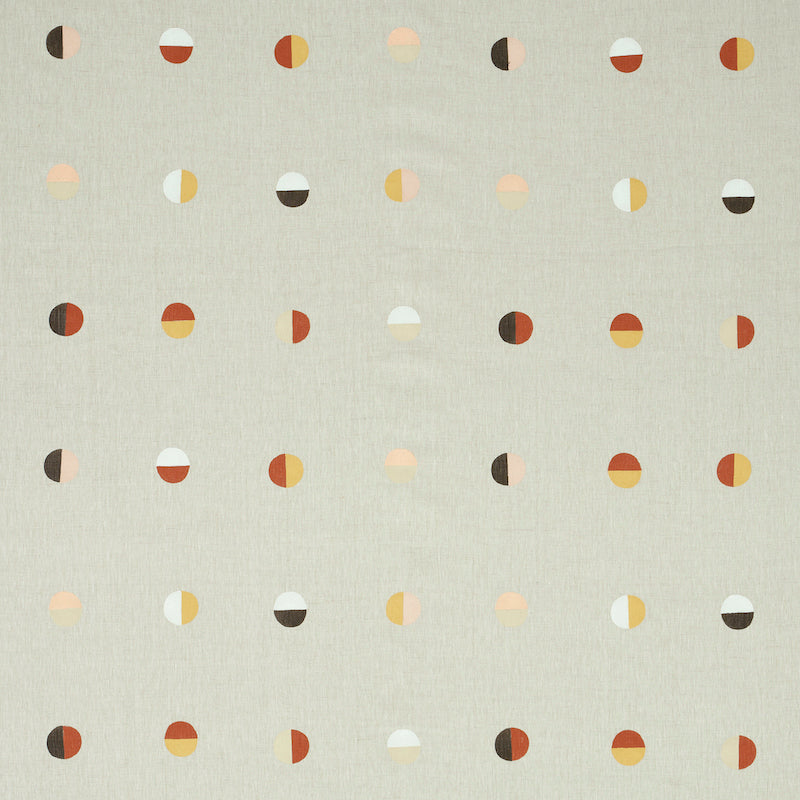 Beige woven fabric with a Joshua Tree desert moons pattern in warm orange, yellow, brown and white tones.