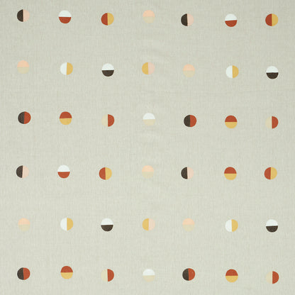 Beige woven fabric with a Joshua Tree desert moons pattern in warm orange, yellow, brown and white tones.