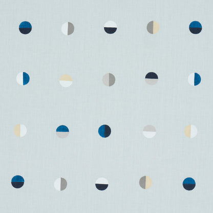 Soft blue fabric with a repeating grid of half-circle motifs in navy, blue, grey, beige and white.