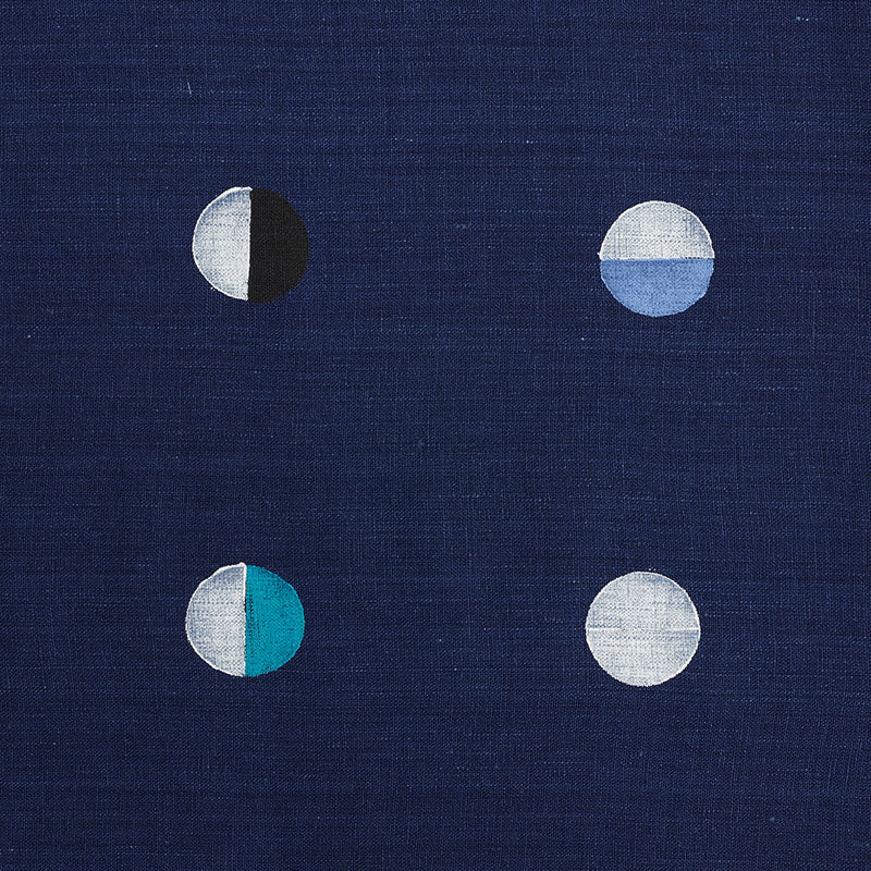 Navy fabric with four small two-tone circles in a 2x2 grid, each circle split in half with contrasting colors.