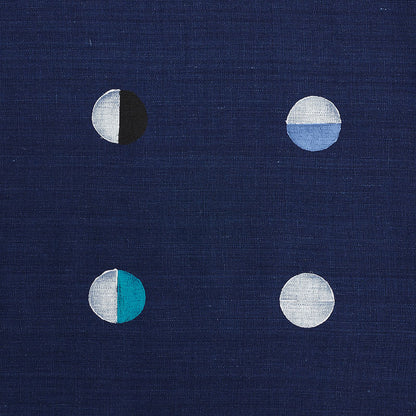 Navy fabric with four small two-tone circles in a 2x2 grid, each circle split in half with contrasting colors.