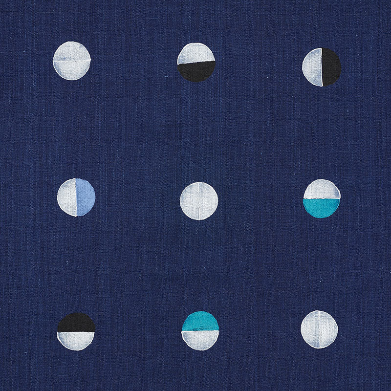 Navy blue fabric with a 3x3 grid of small half-circle motifs in white, gray, black and teal.