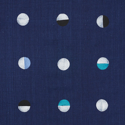 Navy blue fabric with a 3x3 grid of small half-circle motifs in white, gray, black and teal.