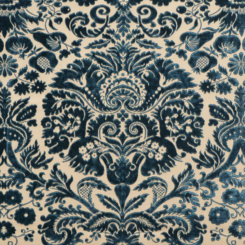 Navy blue damask floral pattern on ivory background; ornate baroque-inspired textile design.