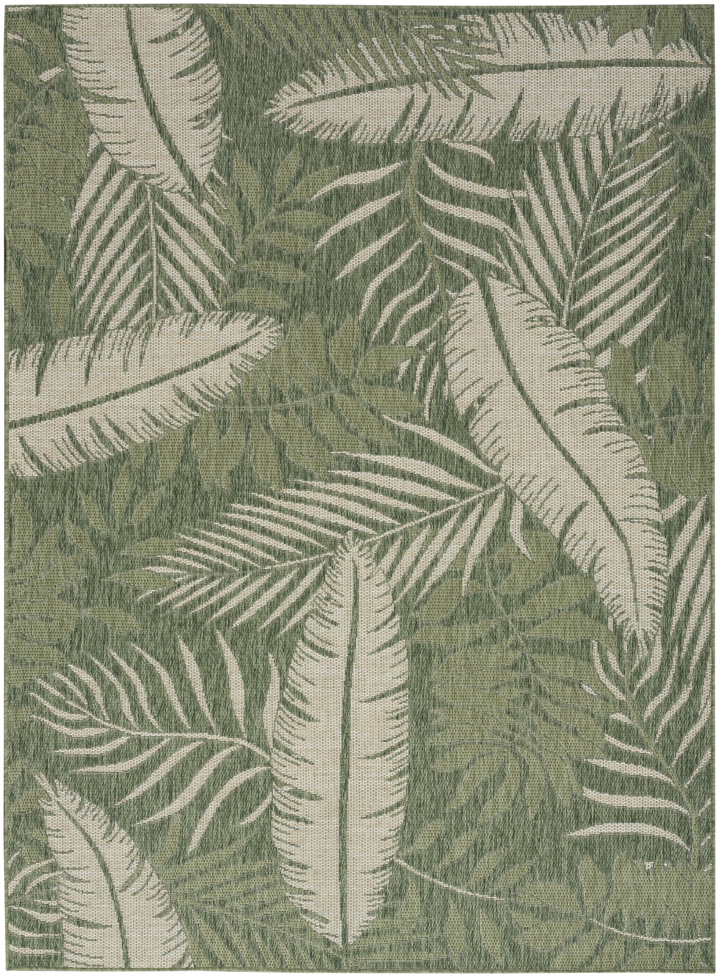 Green rug with white palm leaf pattern; tropical botanical style for living room decor.