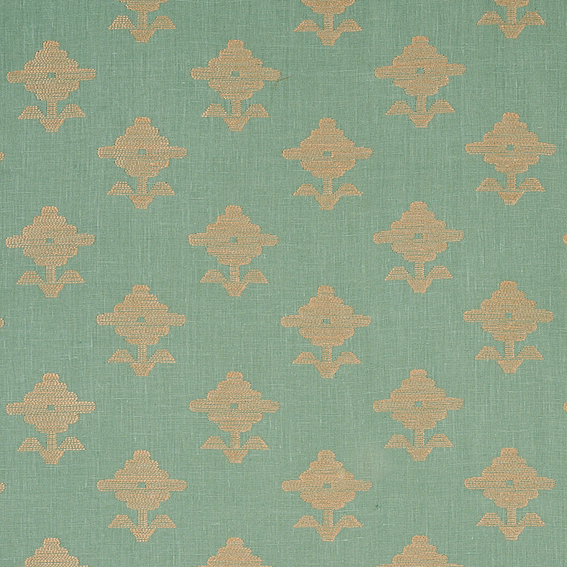 Teal fabric with repeating beige-gold ornamental motifs in a geometric floral pattern.