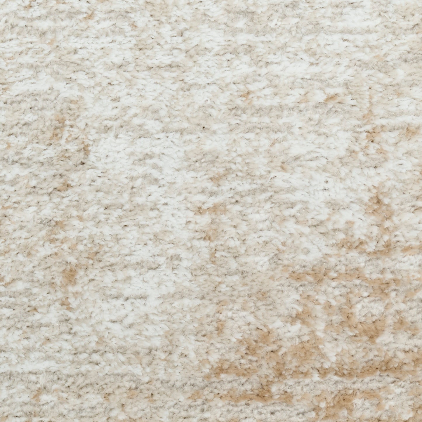 Cream beige shag rug with dense plush pile and subtle tan patches for a cozy, luxurious floor accent.