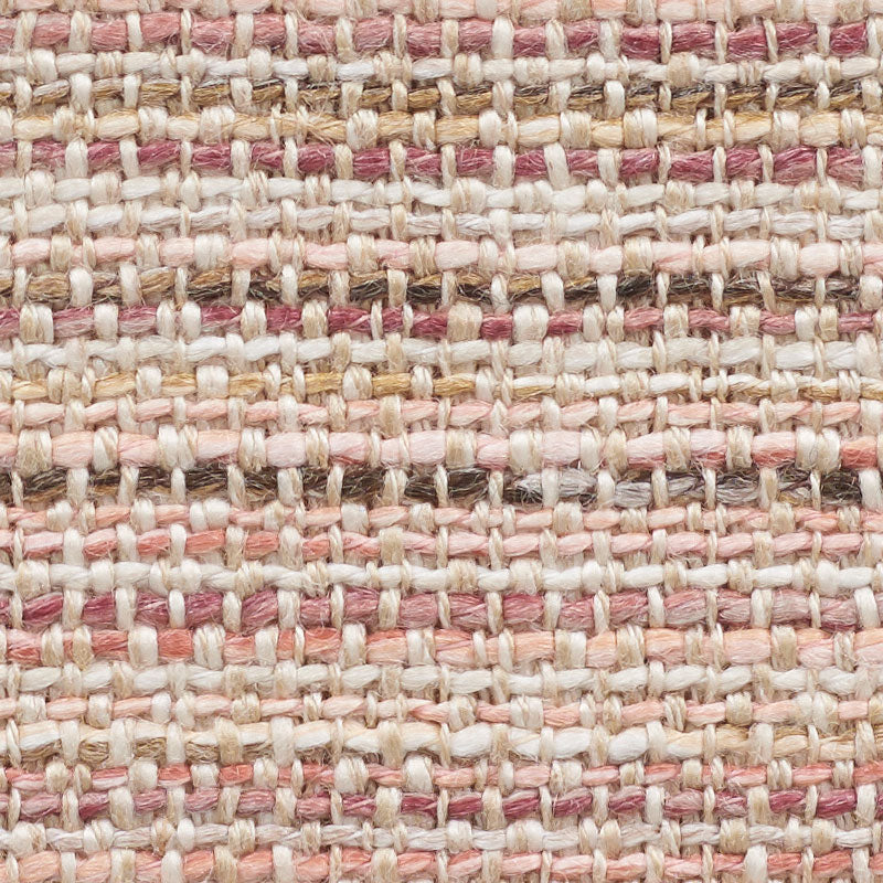Close-up of woven rug texture with pink, cream and beige yarns in a striped, natural-fiber pattern.