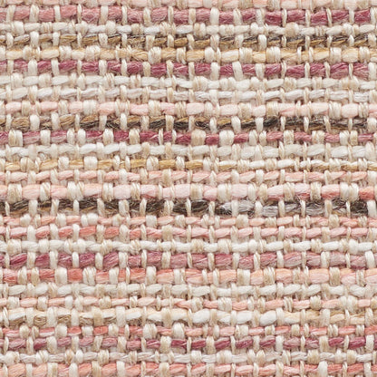 Close-up of woven rug texture with pink, cream and beige yarns in a striped, natural-fiber pattern.