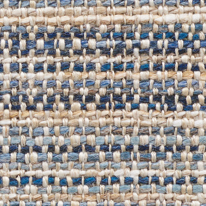 Close-up of beige and blue woven fabric with chunky fibers and a grid-like pattern.