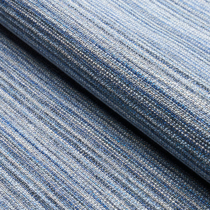 Blue striped woven fabric roll with textured denim-toned yarns; upholstery or crafts.