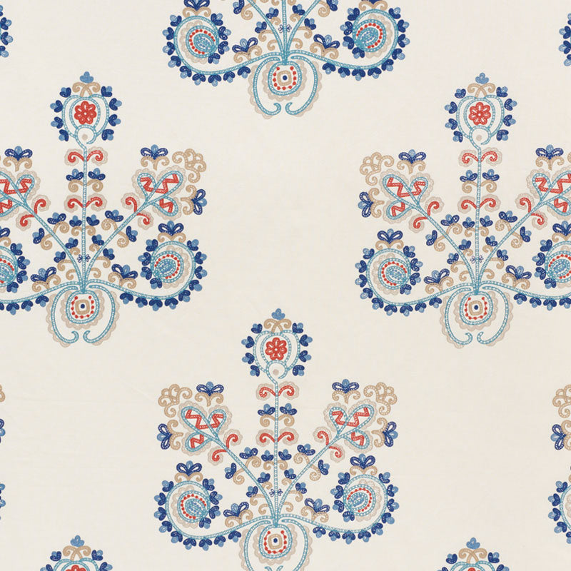 Cream fabric featuring blue, red and beige floral damask motifs in a repeating symmetrical pattern.