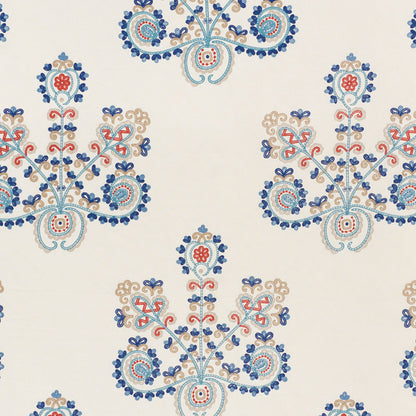 Cream fabric featuring blue, red and beige floral damask motifs in a repeating symmetrical pattern.