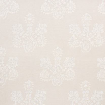 Beige linen fabric with white embroidered damask floral pattern; lace-like, repeating motif.