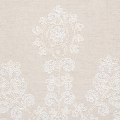 Beige linen fabric with delicate white lace floral motif and ornamental embroidery.