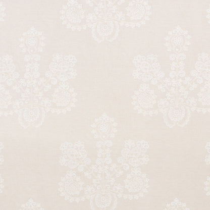 Beige damask wallpaper with subtle white floral motifs; classic, elegant wall covering for living spaces.