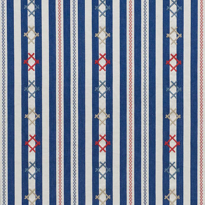 Vertical blue and white striped fabric with decorative red and light-blue X-shaped motifs and diamonds.