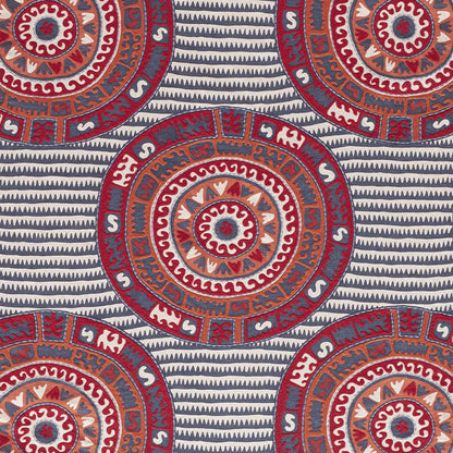 Circular mandala medallions in red, orange and blue on a navy striped background.