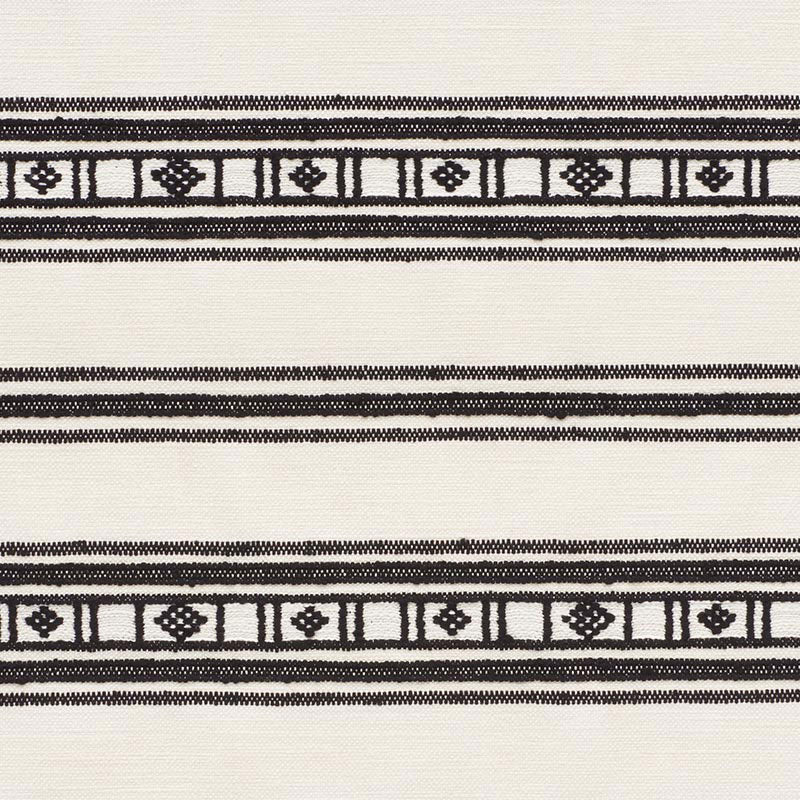 Cream woven fabric with black geometric borders of square and diamond motifs; neutral decorative textile.