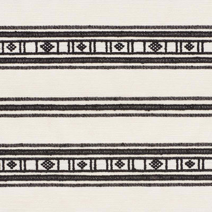 Cream woven fabric with black geometric borders of square and diamond motifs; neutral decorative textile.